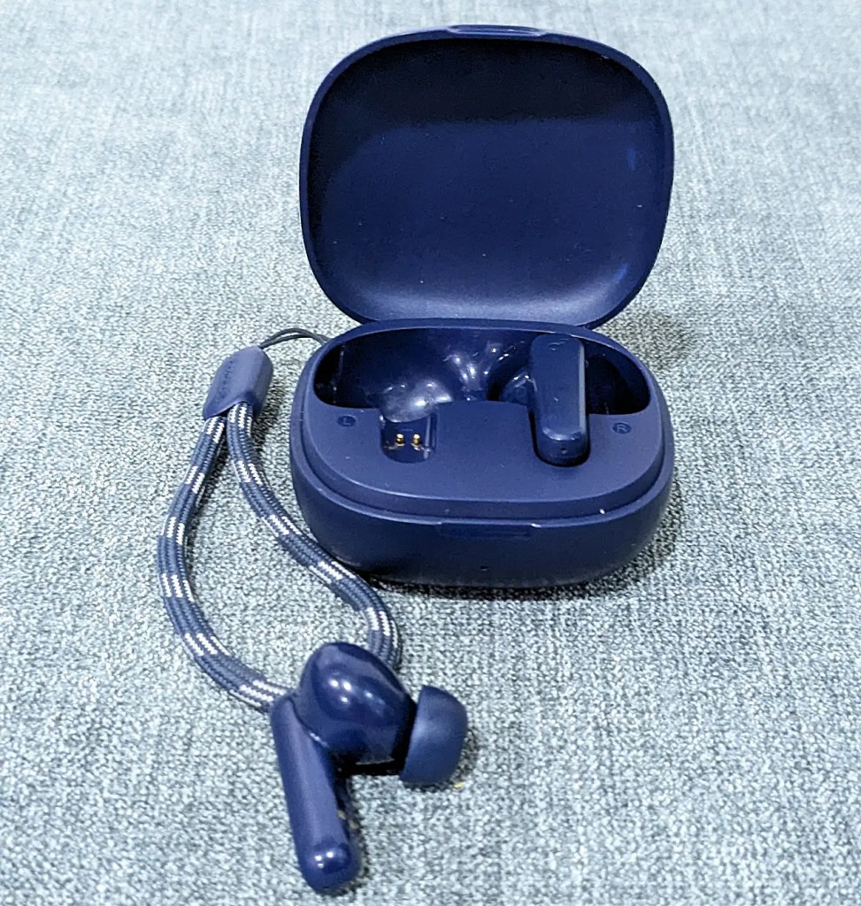 An image of aNavy blue Soundcore P20i wireless earbuds open case with one earbud displayed outside the case